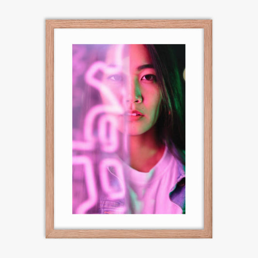 Portrait of young woman lit by pink neon light 18x24 in Poster With Oak Frame