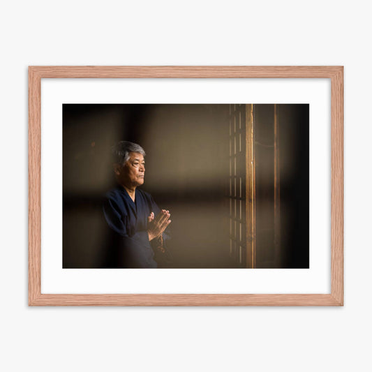 Senior Japanese man praying at a temple 18x24 in Poster With Oak Frame