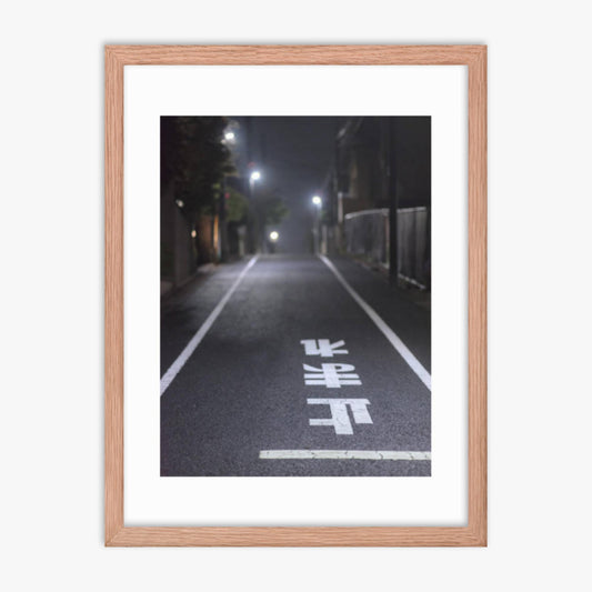 Typical road by night with the stop sign in Japanese written on the ground 18x24 in Poster With Oak Frame